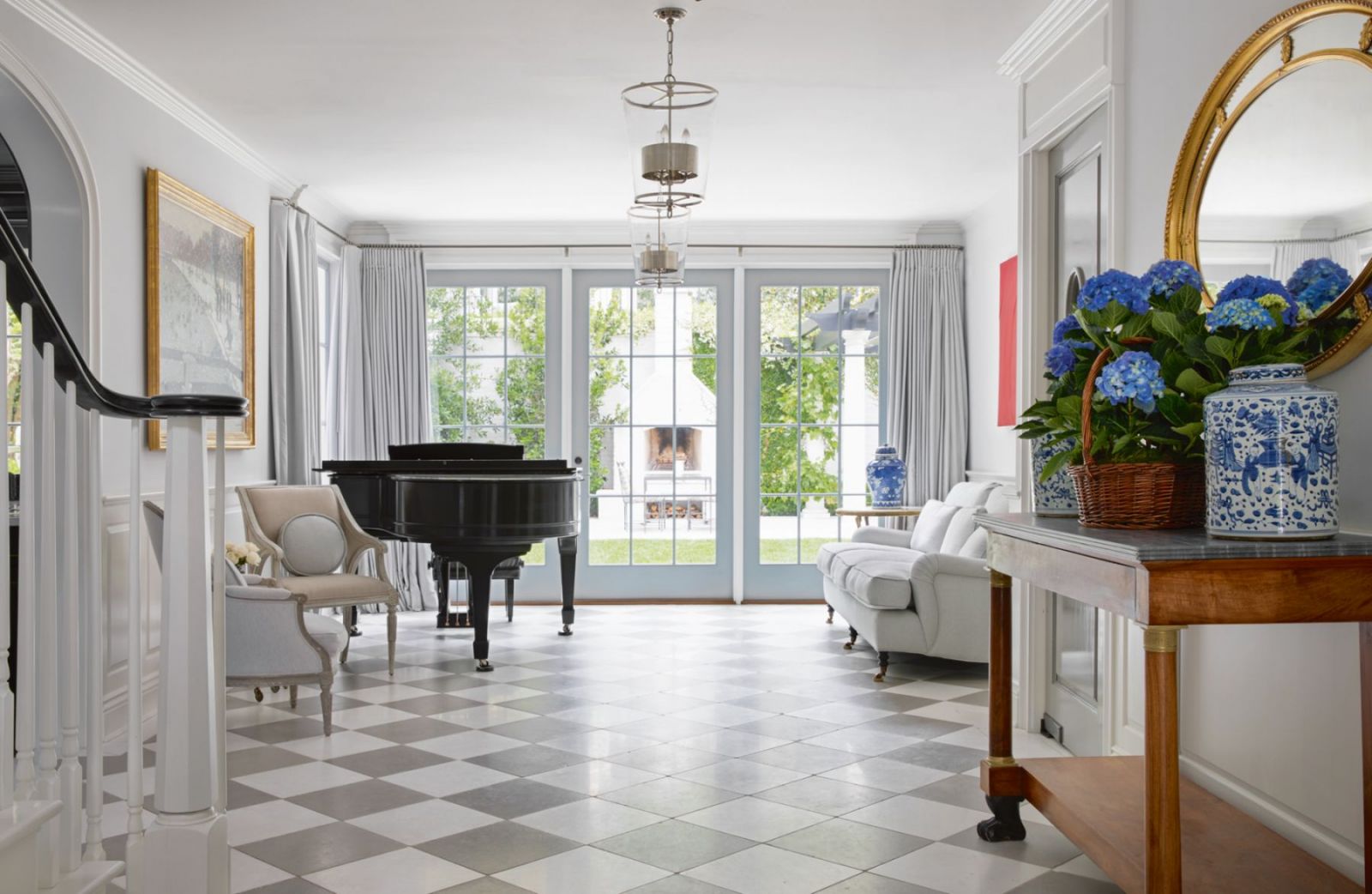 The entry hall with an Austrian Regency baby grand (Photo: Karyn Millet)