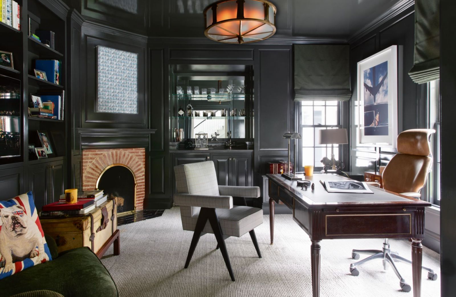 A vintage bronze chandelier, reclaimed from a turn-of-the-century bank, hangs in the study (Photo: Karyn Millet)