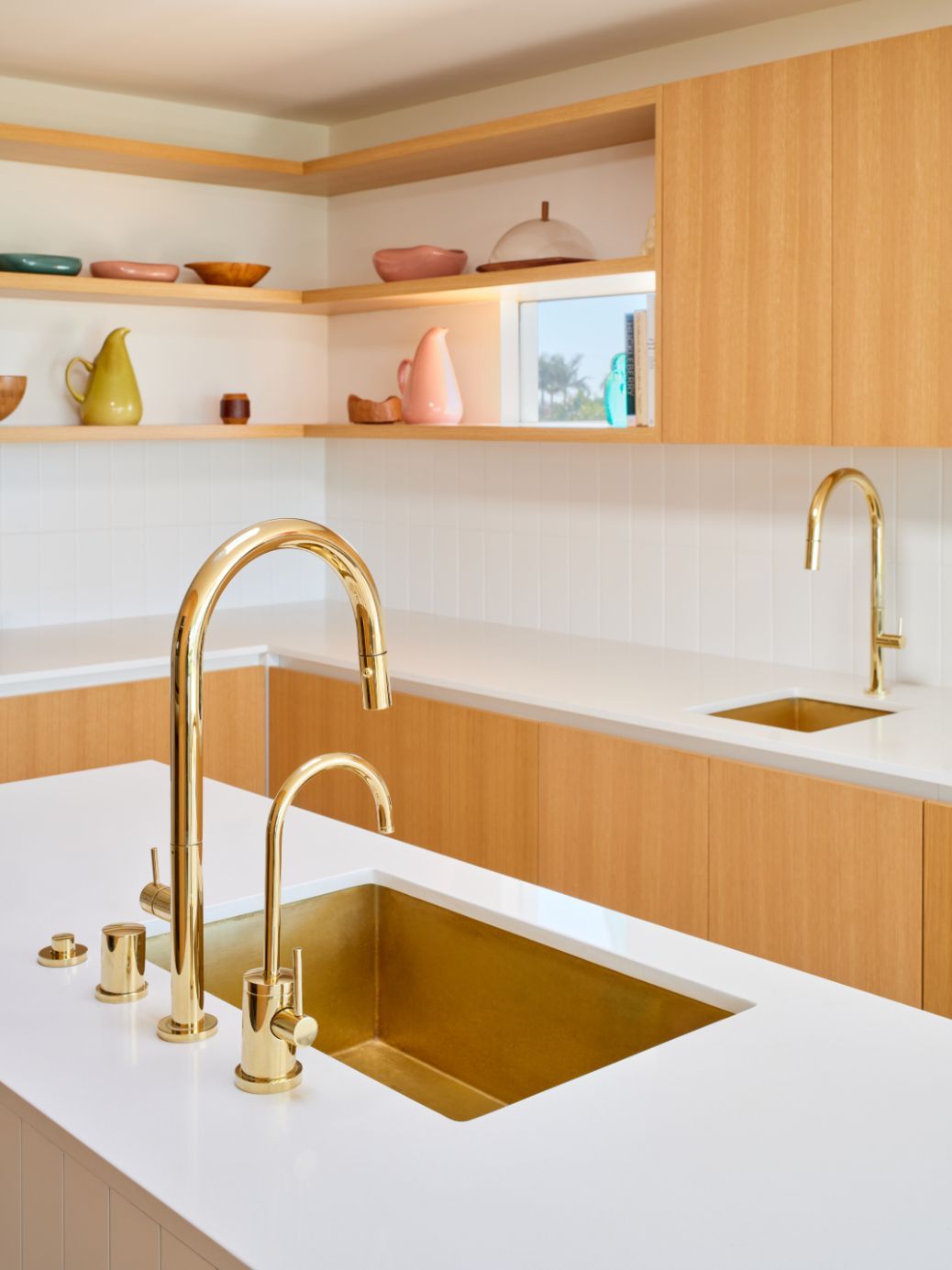 The kitchen with light walnut and gold accents (Photo: Brandon Shigeta)