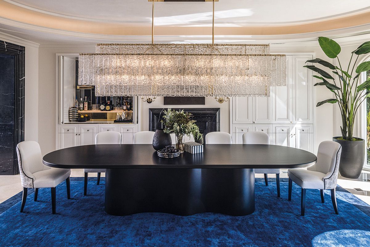 A bespoke chandelier hangs over the custom dining table crafted in Portugal (Photo: Pablo Enriquez)