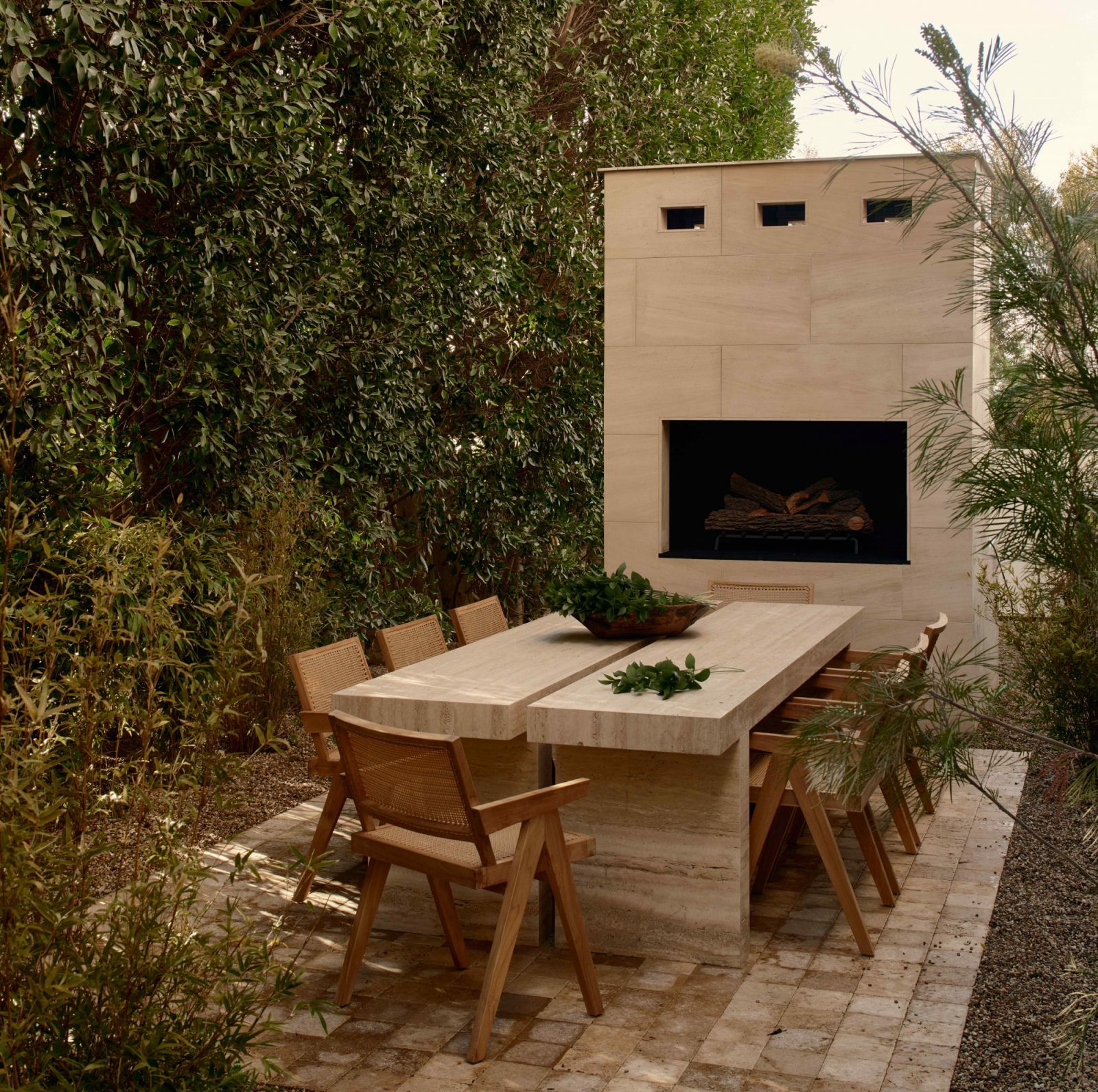 A travertine dining table next to a 15-foot fireplace (Photo: Nils Timms)