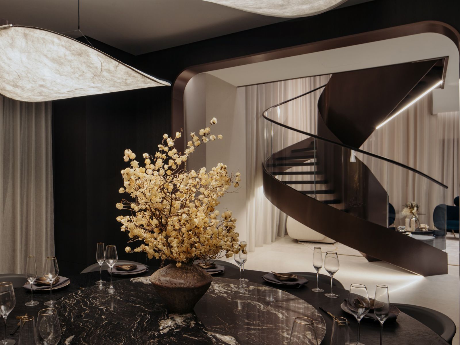 An elliptical staircase combining the various sections of the expansive 6000 sq ft super penthouse