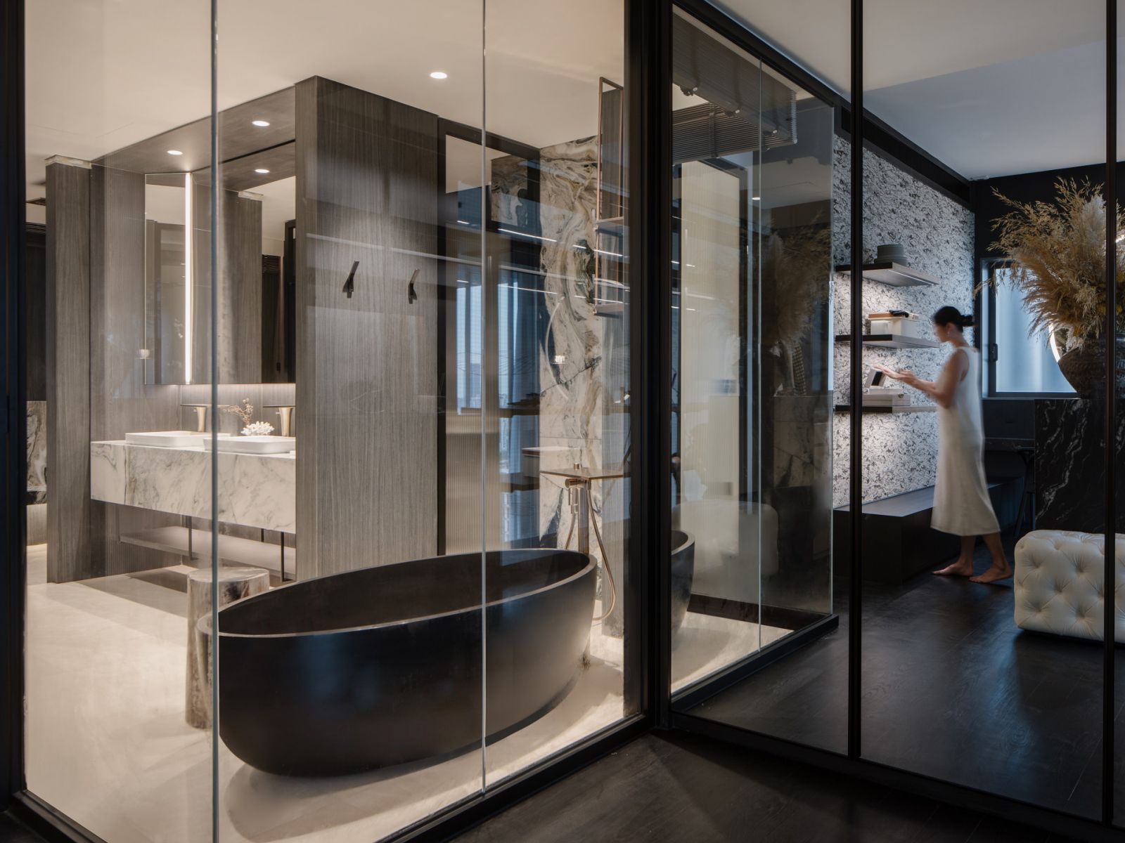 The master bathroom has a statement black bathtub