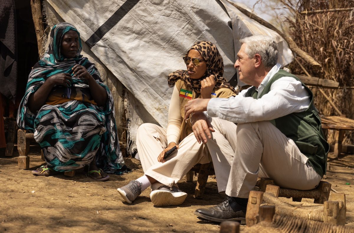 High Commissioner Filippo Grandi speaks with Teyiba Hassen, centre, Director General of Ethiopia’s Refugees and Returnees Service, and Sudanese refugee Hawa, 40, left, at the Kurmuk transit centre in the Benishangul-Gumuz region of northwestern Ethiopia. Grandi conducted a three-day mission to the country in January 2024. Hawa, 40, fled the violence in Sudan with her ten children and 80-year-old mother in June last year. Image: UNHCR/Tiksa Negeri