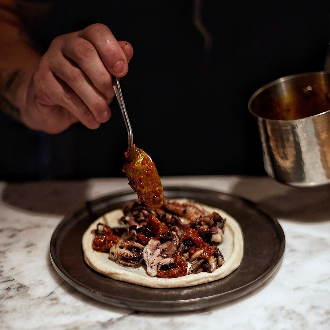 Quince - BBQ Australian octopus with peppercorn oil, roasted peanuts and brown butter vinaigrette