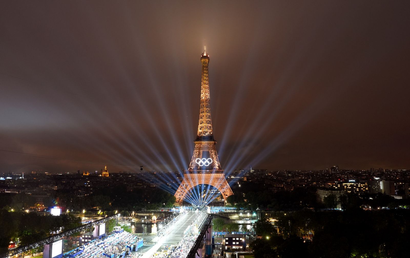 PARIS, FRANCE - JULY 26: Lights show is staged on the Eiffel Tower during the opening ceremony of the Paris 2024 Olympic Games in Paris, France, July 26, 2024. (Photo by Cheng Min - Pool/Getty Images)