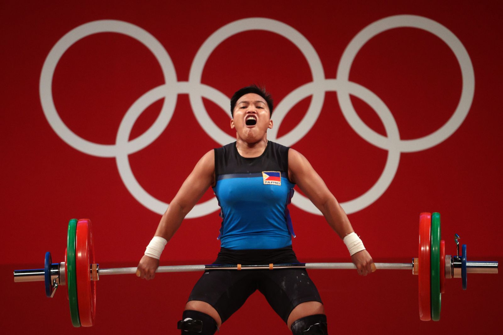 Elreen Ann Ando of Team Philippines competes during the Weightlifting - Women's 64kg Group A on day four of the Tokyo 2020 Olympic Games at Tokyo International Forum on July 27, 2021 in Tokyo, Japan. (Photo: Chris Graythen / Getty Images)