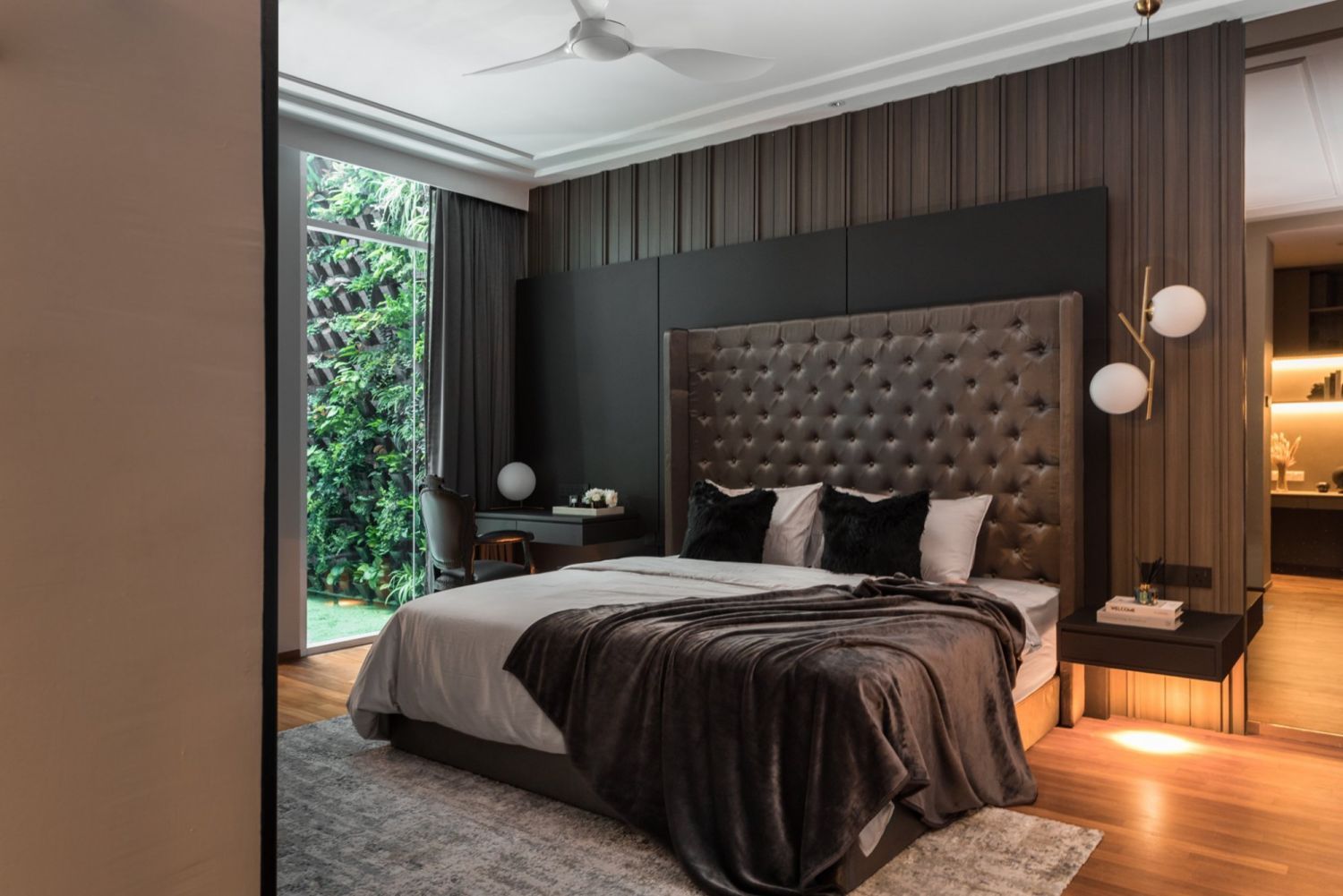 A darker palette was applied in the master bedroom (Photo: TWJPTO)