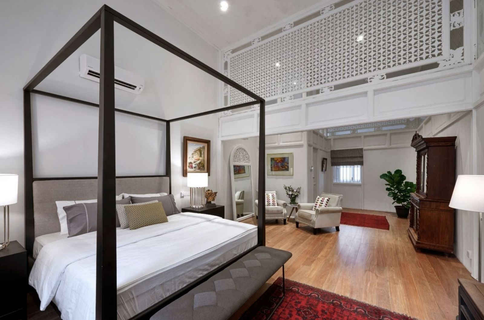 The spacious, airy bedroom is an elegant blend of modern and heritage