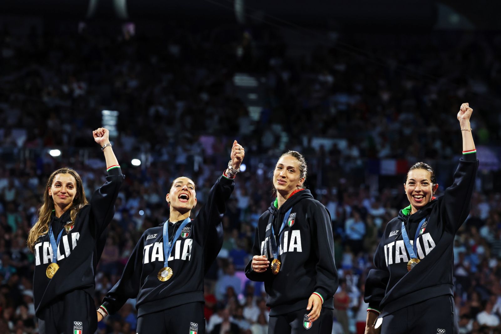 PARIS, FRANCE - JULY 30: Gold medalists of Team Italy celebrate on the podium during the Fencing Women's Epee medal ceremony on day four of the Olympic Games Paris 2024 at Grand Palais on July 30, 2024 in Paris, France. (Photo by Elsa/Getty Images)