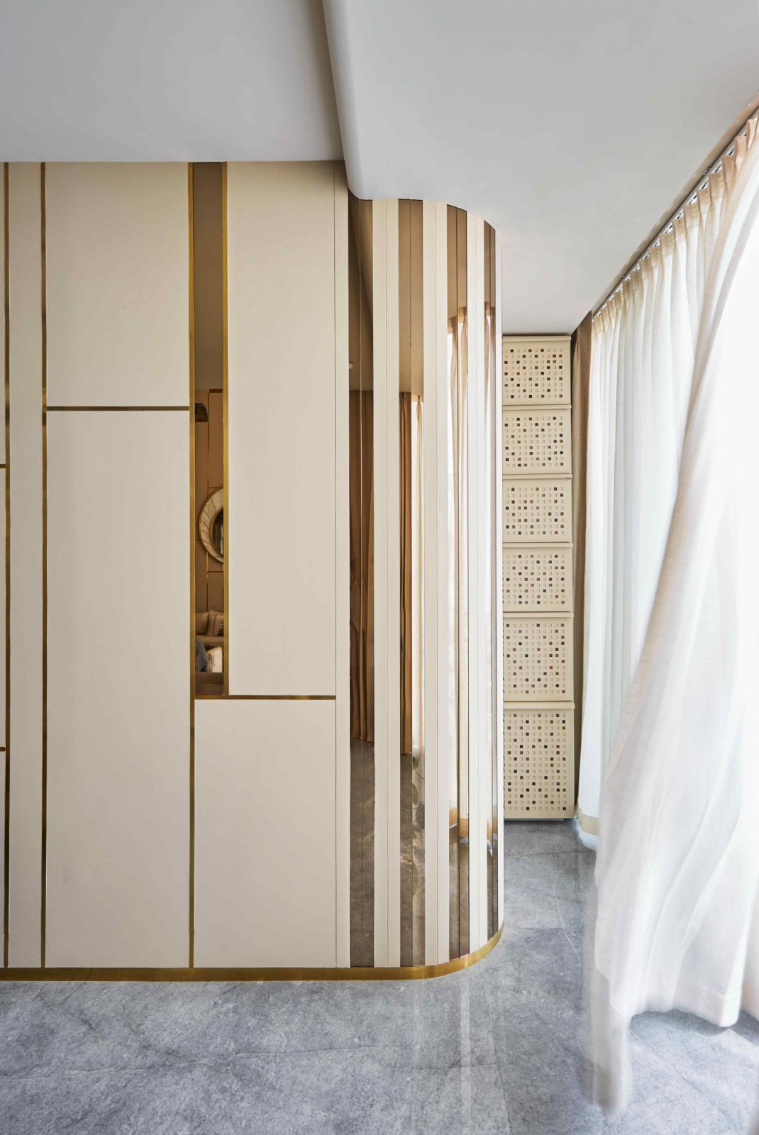 Grid-patterned cabinets with metallic inlays offer ample storage