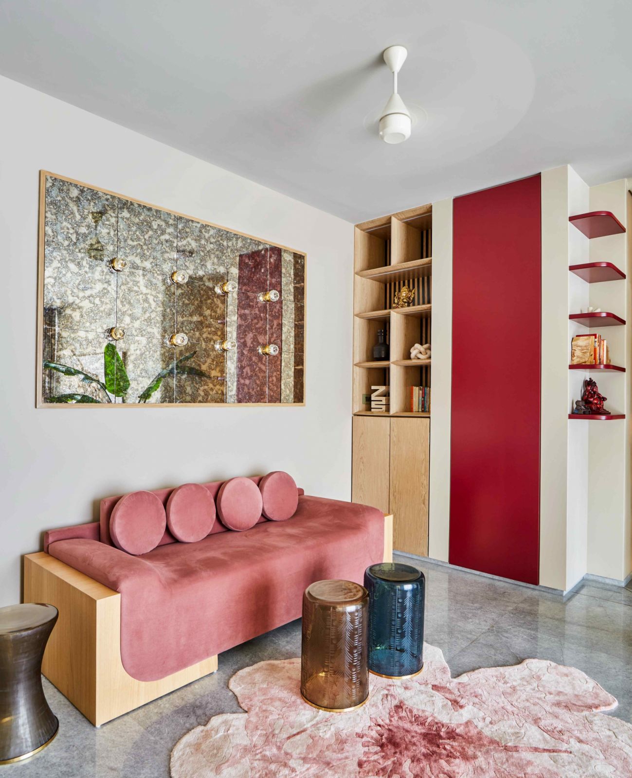 The lounge in the upper floor in vibrant hues of maroon and pink