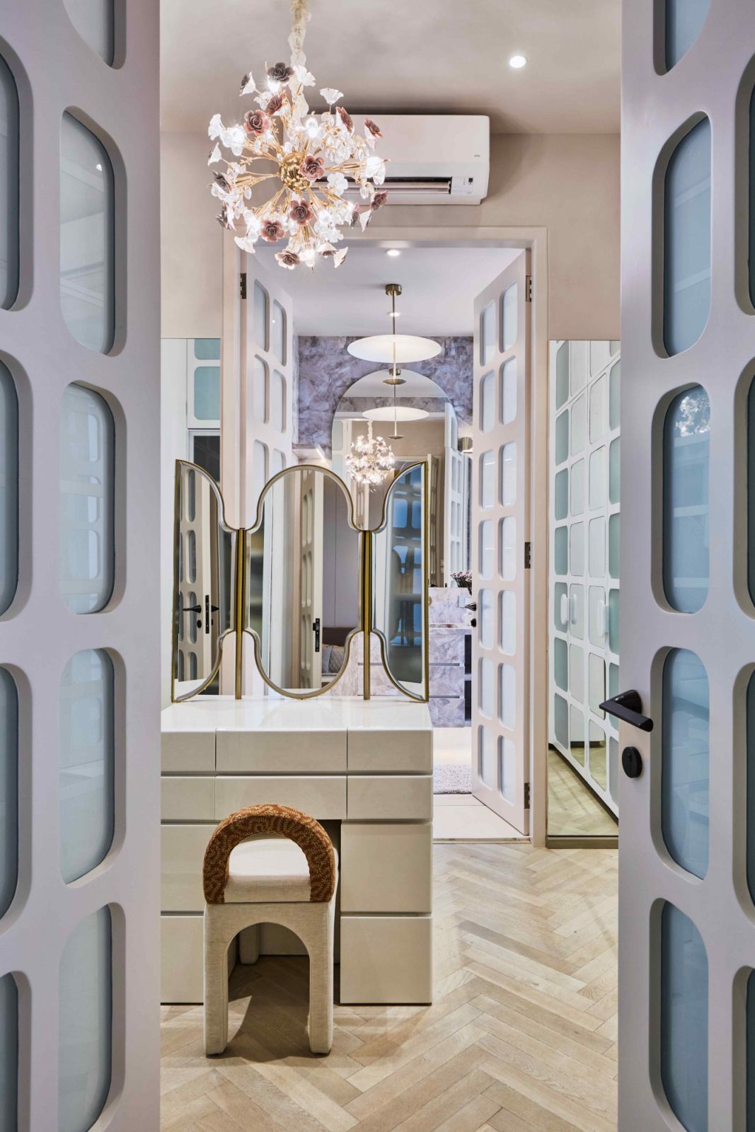 French panels open into a walk-in wardrobe in the master bedroom